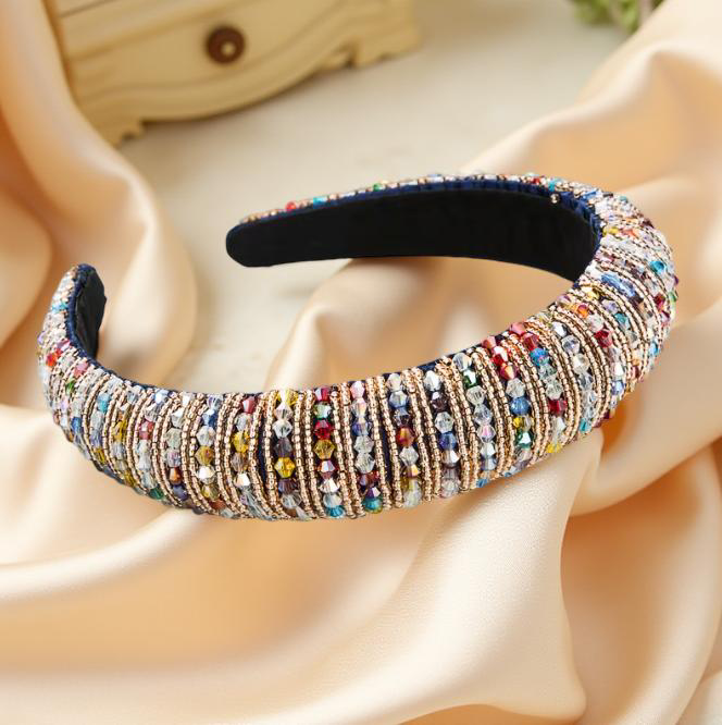 Jewel Crown Headband in Multicolor against a Cream Background