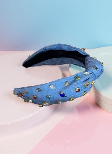 Rhinestone headband in Denim against a pastel background